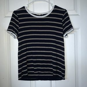 dark blue, white, and gold t-shirt